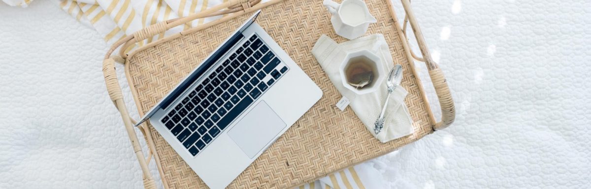 Laptop on a wicker tray