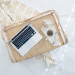 Laptop on a wicker tray