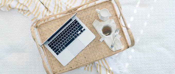 Laptop on a wicker tray